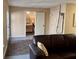 Comfortable living room with a glimpse of a bedroom through an open doorway at 117 Manous Dr, Canton, GA 30115