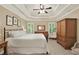 Serene main bedroom with tray ceilings, neutral colors, and ample natural light from large windows at 117 Manous Dr, Canton, GA 30115