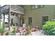 Inviting backyard patio with outdoor seating, mature plants, and space for grilling at 117 Manous Dr, Canton, GA 30115