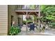 Lower patio with grill, flowering plants, and string lights for outdoor entertaining at 117 Manous Dr, Canton, GA 30115