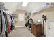 Spacious walk-in closet featuring ample shelving and organizational space for clothes and accessories at 117 Manous Dr, Canton, GA 30115