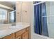 Bathroom featuring a single sink vanity with a mirror and shower with sliding glass doors at 223 Chads Ford Way, Roswell, GA 30076