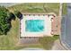 An aerial shot of the community pool with crystal clear water, surrounded by lush landscaping at 223 Chads Ford Way, Roswell, GA 30076