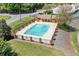 Aerial view of the community pool, with clear blue water, perfect for relaxation and recreation at 223 Chads Ford Way, Roswell, GA 30076
