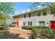 Charming townhome with freshly painted exterior and well-maintained landscaping at 223 Chads Ford Way, Roswell, GA 30076