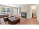 Spacious living room with hardwood floors, a gas fireplace, and an open layout at 223 Chads Ford Way, Roswell, GA 30076