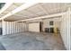 A covered parking area with space for multiple vehicles and storage at 223 Chads Ford Way, Roswell, GA 30076