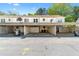 A covered parking area for multiple tenants at 223 Chads Ford Way, Roswell, GA 30076