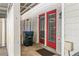 Outdoor patio with red french doors, siding, and room for seating at 223 Chads Ford Way, Roswell, GA 30076