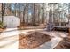 A storage shed is located near the brick patio and walkway, leading toward the deck at 3235 Crestview Dr, Cumming, GA 30041