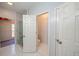 Bright bathroom featuring a glass shower, open doorway to toilet and view of closet at 3235 Crestview Dr, Cumming, GA 30041