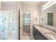 Bathroom features double vanity and shower with bathtub combo at 3235 Crestview Dr, Cumming, GA 30041