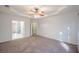 Spacious bedroom featuring an open doorway to bathroom, carpet flooring and neutral wall color at 3235 Crestview Dr, Cumming, GA 30041