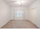 Bright bedroom with closet and window dressed with curtains at 3235 Crestview Dr, Cumming, GA 30041