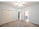 Bedroom with ceiling fan, closet, and bathroom view at 3235 Crestview Dr, Cumming, GA 30041
