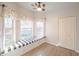 Cozy breakfast nook with a window bench, natural light, and laminate flooring at 3235 Crestview Dr, Cumming, GA 30041