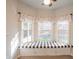 Cozy breakfast nook with a window bench, natural light, and laminate flooring at 3235 Crestview Dr, Cumming, GA 30041