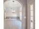 Elegant dining room with modern light fixture and chair rail detail at 3235 Crestview Dr, Cumming, GA 30041