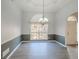 Dining room features tray ceilings, laminate flooring and large window letting in tons of natural light at 3235 Crestview Dr, Cumming, GA 30041