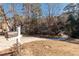 Long driveway leading to a home surrounded by trees, with a mailbox in the foreground at 3235 Crestview Dr, Cumming, GA 30041