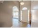 Foyer features archways and gray walls with wood flooring, leading to other rooms at 3235 Crestview Dr, Cumming, GA 30041