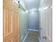 Hallway with wood-look floors, a sliding door, and ample lighting at 3235 Crestview Dr, Cumming, GA 30041