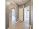Spacious hallway with beautiful laminate flooring, archway and neutral colored walls at 3235 Crestview Dr, Cumming, GA 30041