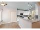 Modern kitchen with granite countertops, white cabinets, tile backsplash, and stainless steel appliances at 3235 Crestview Dr, Cumming, GA 30041