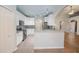 Well lit modern kitchen features white cabinets, stainless steel appliances, and granite countertops at 3235 Crestview Dr, Cumming, GA 30041