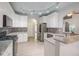 Bright kitchen with granite countertops, gray subway tile, and stainless steel appliances at 3235 Crestview Dr, Cumming, GA 30041