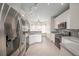 Modern kitchen boasts white cabinets, stainless steel appliances, and breakfast nook at 3235 Crestview Dr, Cumming, GA 30041