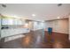 Bright, open living space featuring a small kitchen area, hardwood floors, and ample natural light at 3235 Crestview Dr, Cumming, GA 30041