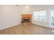 Bright living room features a beautiful fireplace, vaulted ceilings, and french doors to the exterior at 3235 Crestview Dr, Cumming, GA 30041