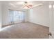 Spacious main bedroom featuring trey ceilings, plush carpet, and ample natural light at 3235 Crestview Dr, Cumming, GA 30041