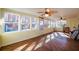 Sunny sunroom featuring wood flooring, and plenty of natural light from large windows at 3235 Crestview Dr, Cumming, GA 30041
