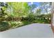 Spacious backyard featuring a concrete patio and lush green lawn, perfect for outdoor entertaining at 4044 Ashentree Dr, Brookhaven, GA 30341