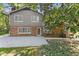 The home's backyard has a concrete patio, brick exterior, and well-maintained lawn at 4044 Ashentree Dr, Brookhaven, GA 30341