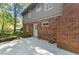 Back exterior featuring a concrete patio, and brick facade at 4044 Ashentree Dr, Brookhaven, GA 30341