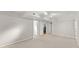 Spacious basement with neutral carpet, fresh paint, and multiple doors at 4044 Ashentree Dr, Brookhaven, GA 30341