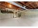 Unfinished basement featuring a concrete floor, exposed ducts, and cinder block walls, offering ample storage space at 4044 Ashentree Dr, Brookhaven, GA 30341