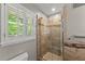 Updated bathroom features sleek shower and marble-style tiling at 4044 Ashentree Dr, Brookhaven, GA 30341