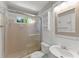 Bright bathroom featuring a tiled shower with sliding glass door and a modern vanity at 4044 Ashentree Dr, Brookhaven, GA 30341