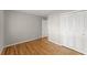Hardwood bedroom featuring closet and door leading to en-suite bathroom at 4044 Ashentree Dr, Brookhaven, GA 30341