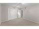 Bedroom featuring neutral carpet, track lighting, and a double door closet at 4044 Ashentree Dr, Brookhaven, GA 30341
