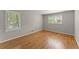Bright bedroom with hardwood flooring and shuttered windows at 4044 Ashentree Dr, Brookhaven, GA 30341