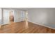Bright bedroom featuring pristine hardwood floors and direct access to an en-suite bathroom at 4044 Ashentree Dr, Brookhaven, GA 30341