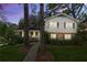 Charming two-story home with a well-manicured lawn and a sidewalk leading to the front porch at 4044 Ashentree Dr, Brookhaven, GA 30341