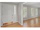 Bright foyer features hardwood floors, white trim and a front door with sidelight windows providing natural light at 4044 Ashentree Dr, Brookhaven, GA 30341