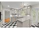 Charming kitchen with granite countertops, stainless appliances, and checkered tile floor at 4044 Ashentree Dr, Brookhaven, GA 30341