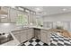 Updated kitchen featuring granite countertops, stainless steel appliances, and checkered tile flooring at 4044 Ashentree Dr, Brookhaven, GA 30341